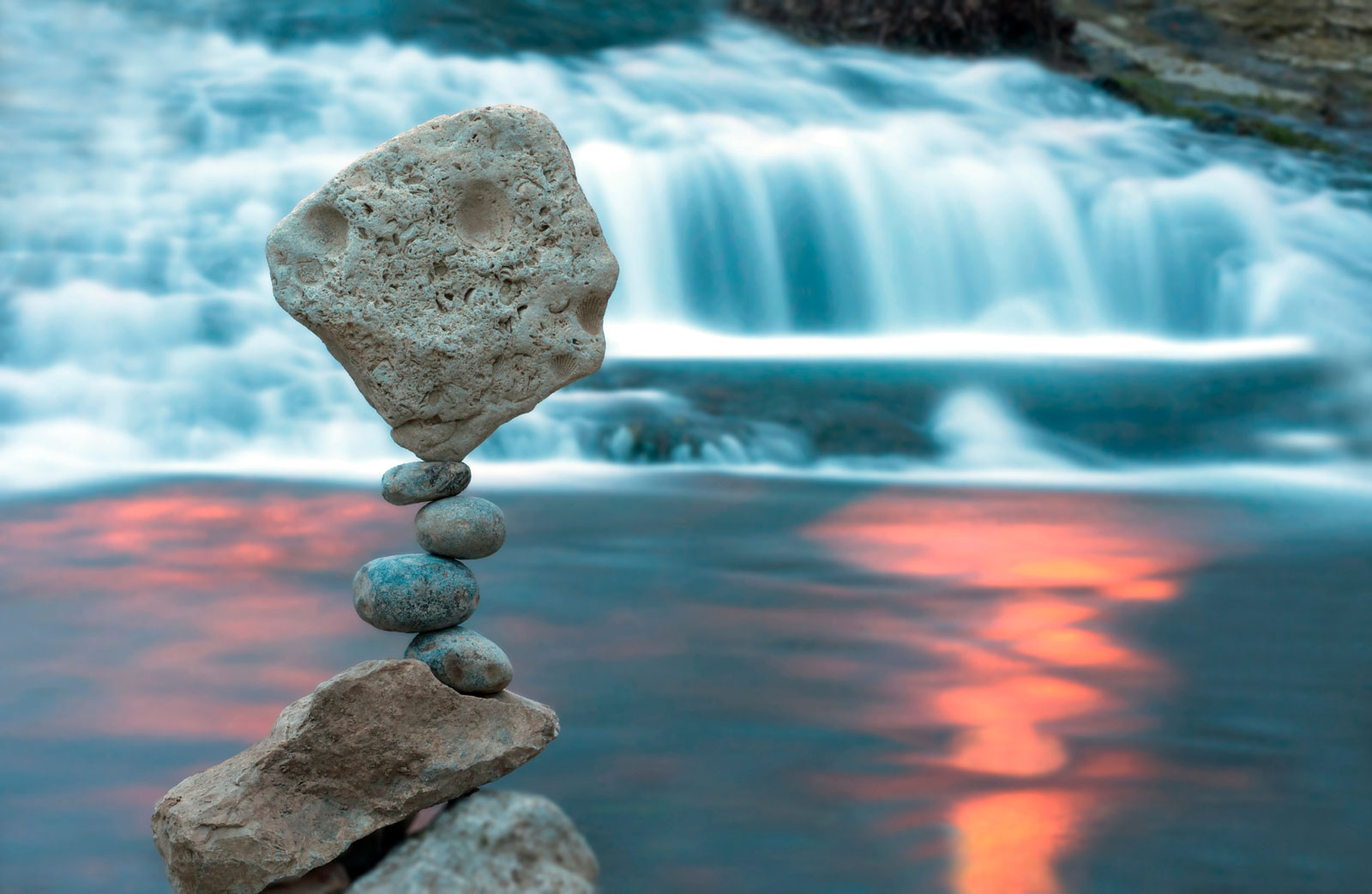 zen stones behind a waterfall - Investment Process