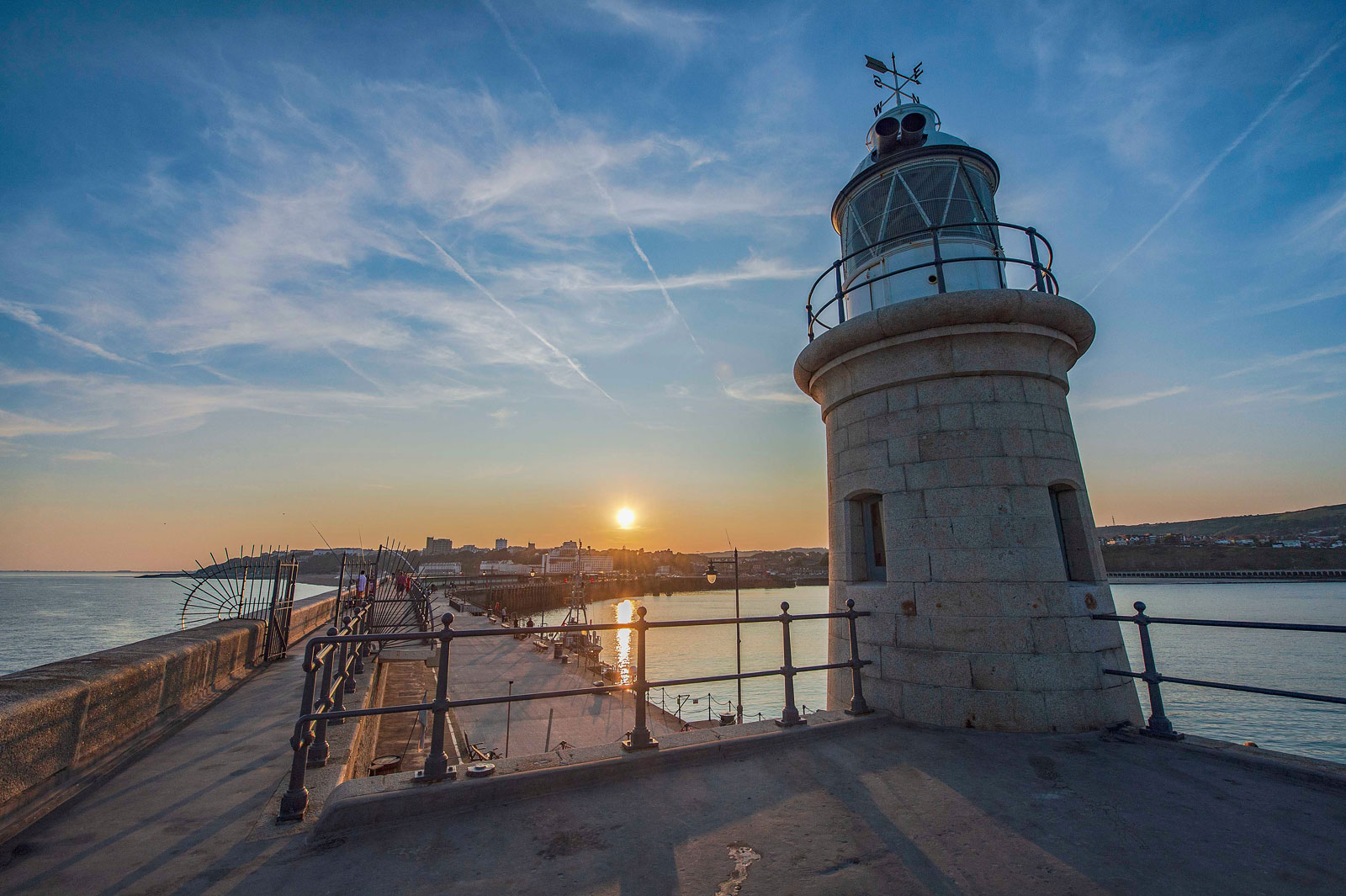 lighthouse at sunset - About Concepts Discretionary Investments